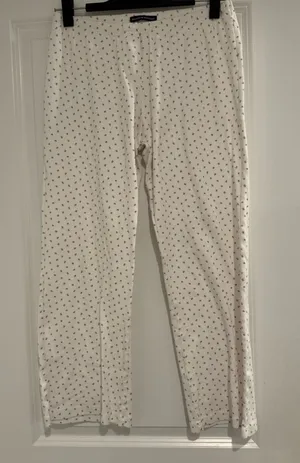 Brandy Melville White Straight-Leg Pants with Tiny Pink Floral Print thumbnail 1