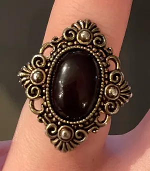 Vintage style statement ring. Diamond shaped with black oval center. Adjustable thumbnail 1
