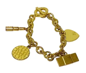 Estee Lauder The Golden Icons Gold Tone Charm Bracelet‎ thumbnail 1