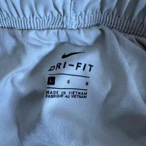 Nike Dri‎ Fit Running Shorts Women Light Gray Orange Trim Athletic Gym Size L thumbnail 5