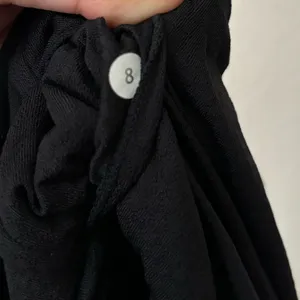 Lululemon Ruffle Front Black Sleeveless Top 8 thumbnail 3