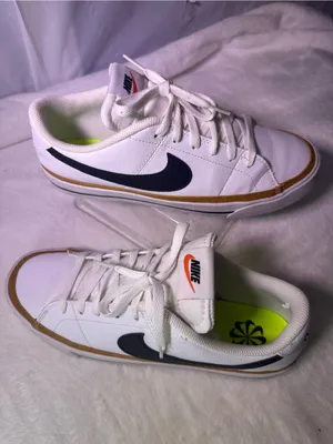 Nike White Sneakers with Black Swoosh and Orange Accent thumbnail 2
