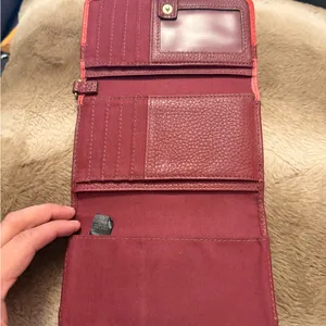 Fossil, leather bifold wallet; red/maroon Has a pen mark on the front thumbnail 3