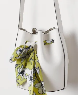 Minimal white bucket bag with removable floral scarf detail thumbnail 1