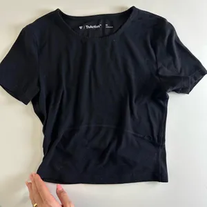 Aritzia Tna Butter Set this set comes with cheeky biker shorts, hold tight bra, and butter bound t-shirt all in black set retails for $136 thumbnail 3