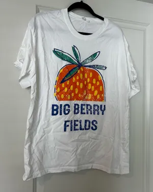 100% white cotton oversized strawberry graphic tee Large size Some lifting on the graphic thumbnail 1