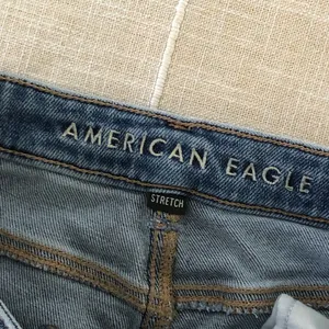 12 Long American Eagle Outfitters High-Rise Distressed Blue Mom Jeans thumbnail 6