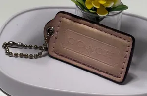 Coach light pink tag thumbnail 1