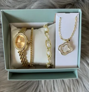 NIB Gold-tone Watch and Bracelet Set with Clover Pendant thumbnail 1