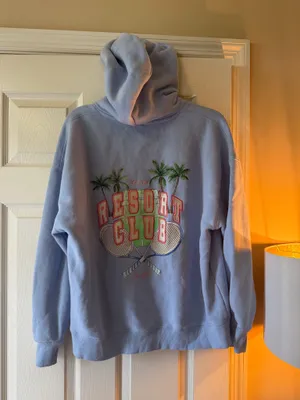 Cotton On Blue Resort Club hoodie with graphic featuring palm trees, tennis rackets, and the words 'RESORT CLUB' thumbnail 1