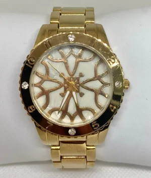 Women’s gold tone watch 38mm round quartz analog mop dial size 7” running thumbnail 1