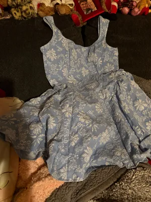 Light blue ladies dress with an all-over white floral print. Fit-and-flare silhouette with wide shoulder straps for comfortable wear. Soft woven fabric offers gentle structure and twirl-ready skirt. Perfect for parties and special occasions. thumbnail 1