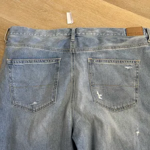 NWT American Eagle Light Wash Distressed Denim Mom Jeans thumbnail 7