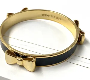 My flat in London black and gold bow bangle bracelet thumbnail 1