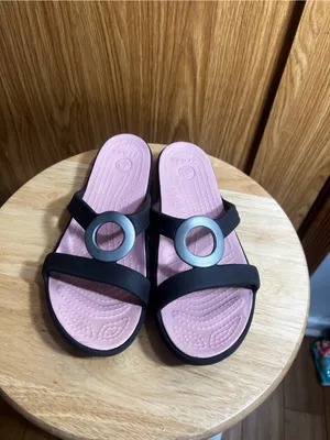 CROCS Women’s Black Slide Sandals with Pink Footbed and Metallic Ring thumbnail 2