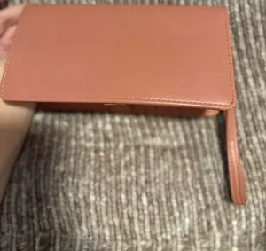 Slim Faux Leather Long Wristlet in Peach pink thumbnail 1