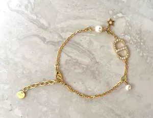 Christian Dior Crystal & Resin Pearl Petit CD Charm Gold Bracelet thumbnail 1