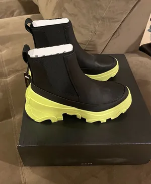 Sorel Black Chelsea Ankle Boots with Neon Green Sole thumbnail 1