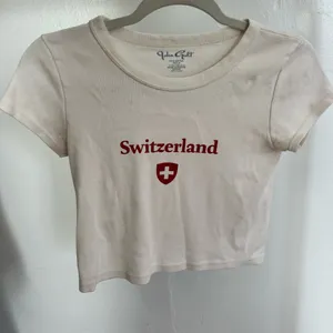 Brandy Melville Beige Switzerland Tee thumbnail 1