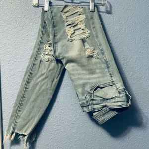 Size 4 American Eagle Distressed Ripped Light Wash Denim Jeans Jeggings Next Lev thumbnail 1