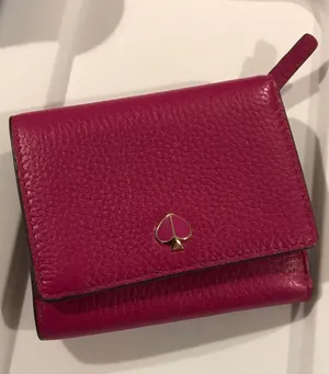 kate spade fuchsia pebbled leather bifold wallet with gold spade logo thumbnail 1