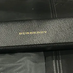 Burberry Black Case with Gold Logo includes Burberry cleaning cloth. thumbnail 5