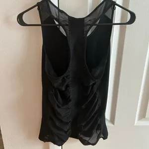 Athleta black bakasana racer back tank top. Mesh back thumbnail 7