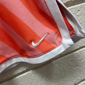 Nike Dri-FIT peach orange and pink diagonal-striped athletic skort size S thumbnail 3