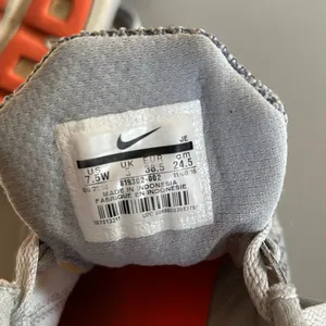 Nike revolution 3 Sneakers in Gray with Bright Orange Accents women’s size 7.5 thumbnail 4