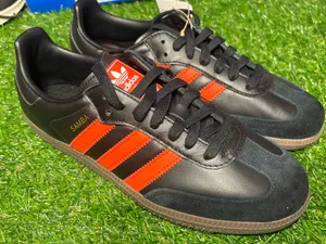Adidas Sambas. Black and orange. Men’s 7.5, women’s 8.5. thumbnail 1