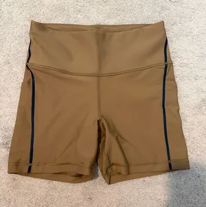 Athleta Brown Interval Stash Tipped 5” Bike Shorts thumbnail 1