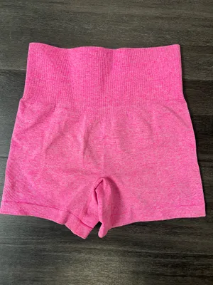 Comfortable high-waist seamless shorts in vibrant pink. Soft, stretchy fabric for unrestricted movement. Smooth waistband provides a flattering, secure fit. Ideal for workouts, yoga, or everyday wear. Size small thumbnail 3