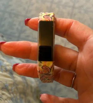 Fitbit barely used. As is. No idea what model. Cute band purchased separately thumbnail 1