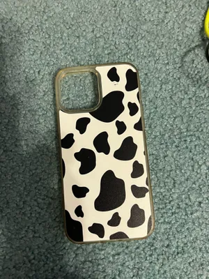 Velvet Caviar Stylish cow print phone case in black and white. Perfect for adding a unique touch to your phone. Black and white cow print phone case for iPhone 13 Pro Max #phoneaccessories thumbnail 1