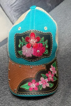 Blue leather trucker hat with floral embroidery thumbnail 1