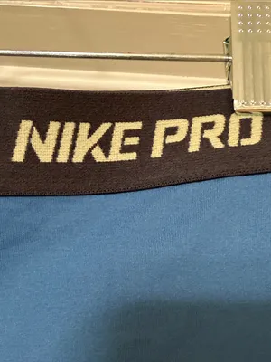 Nike Blue Compression Shorts with Black Waistband and Yellow Swoosh thumbnail 3