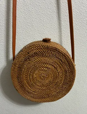 Round Woven RattanCrossbody Bag in Tan with leather strap & snap closure thumbnail 1