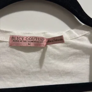 Juicy couture white ruffle top size medium Vintage! Has small pin hole‎ in the thumbnail 2