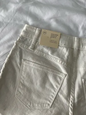 White High-Rise Raw Hem Shorts With Black Tribal Detail thumbnail 5