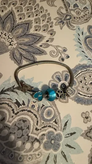 Turquoise Silver Charm Bracelet with Blue Beads birds and peace theme thumbnail 3