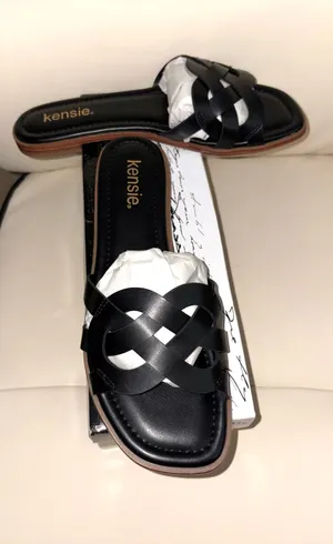 Kensie brand flat sandals feature a black braided design and a square toe. thumbnail 1