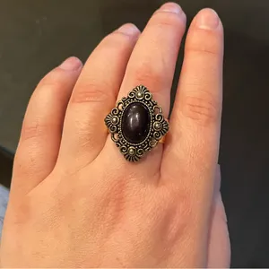 Vintage style statement ring. Diamond shaped with black oval center. Adjustable thumbnail 6