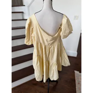 Showpo Light Yellow Asymmetric Off Shoulder Puff Sleeve Tiered Mini Swing Dress thumbnail 3