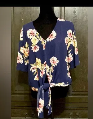 LUQ Navy Floral Tie-Up Blouse - size XSmall ***Refer to measurements. Gently warn & loved. Measurements approximately 20” from armpit to armpit x 20” long. Non-smoking home. priced to sell at as is condition. Don’t like my price, make reasonable offer! And thank you for checking my closet. thumbnail 1