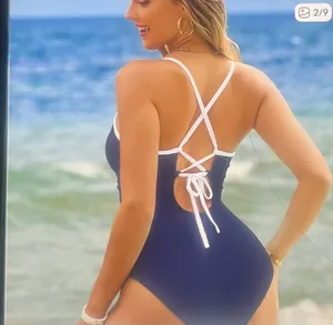 Mbjl Dive into style with this elegant navy and white one- piece swimsuit. Perfect for a chic beach look. thumbnail 2