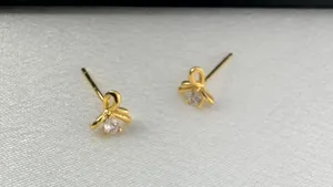 Small CZ Bow Stud Earrings for Women Gold thumbnail 2