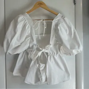 H&M Tie Detail Puff-Sleeved Peplum Blouse. White. Size: Large. thumbnail 5