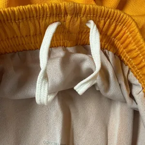 Asics Medley Running Shorts Womens Small Yellow Drawstring Liner NWT TF754-0401 thumbnail 3