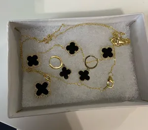Black and gold clover necklace, bracelet and earrings set thumbnail 1
