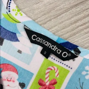 Cassandra O Christmas Santa and snowman nurse scrub top shirt sm pocket and tie thumbnail 4